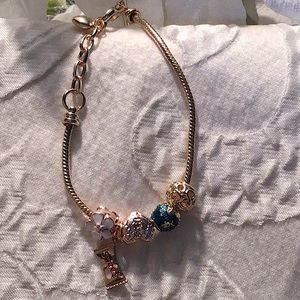 Charm gold tone bracelet